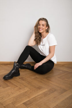 Outofbox model Birgit Pihlak sitting on the floor